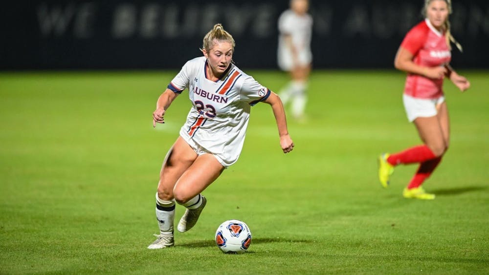 <p>Olivia Candelino dribbles the ball in the First Round of the NCAA Tournament match against Samford at the Auburn Soccer Complex | Grayson Belanger/AU Athletics</p>