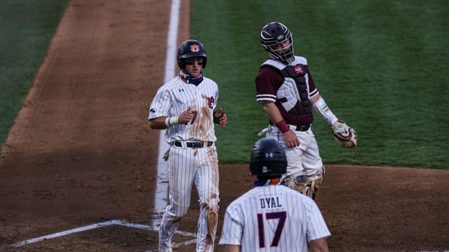 022421_Auburn_IMG_0535_Garrett Farquhar gets to home plate .jpg