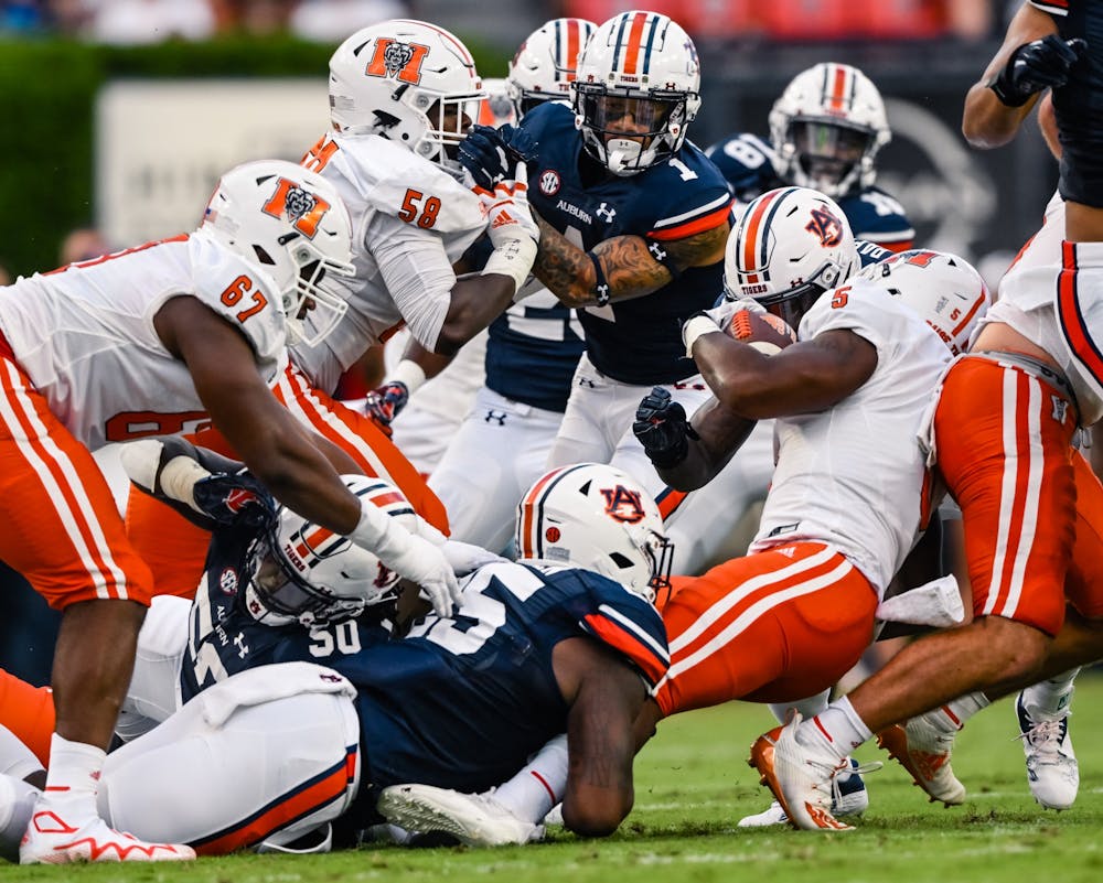 Sep 3, 2022; Auburn, Al, USA;  Colby Wooden (25) gets tackle in the backfield during the game  between Auburn and Mercer at Jordan-Hare Stadium.  Todd Van Emst/AU Athletics