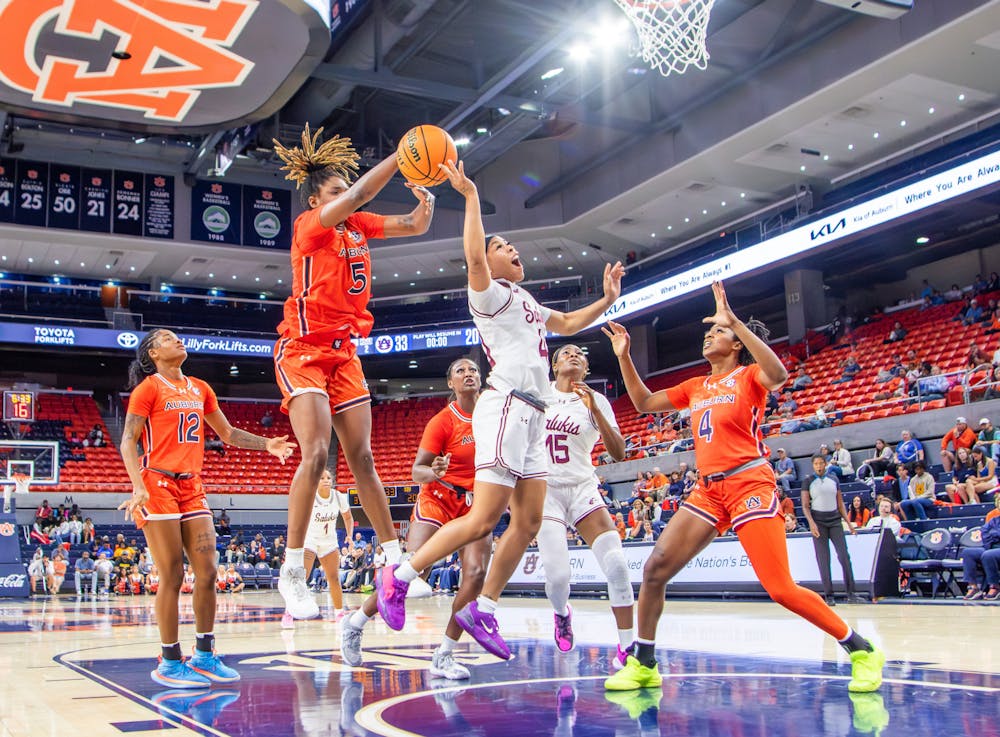 DeYona Gaston (#5) and Kaitlyn Duhon (#4) block a shot in Neville Arena on Nov. 4th 2024.

Danny Zimmermann, The Auburn Plainsman