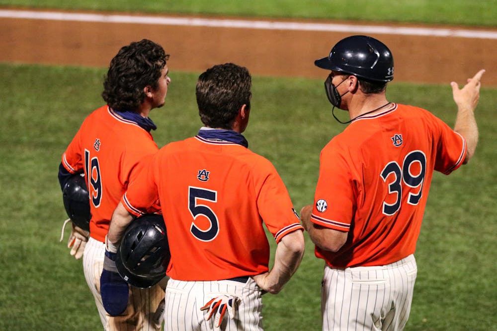 Mar 27, 2021; Auburn, AL, USA; The coach talks to Brody Moore and Kason Howell during the game between Auburn and Kentucky at Plainsman Park. Mandatory Credit: Jacob Taylor/AU Athletics