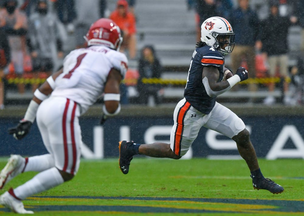 Oct 3, 2020; Auburn, AL, USA; Tank Bigsby (4) rushes for the first down during the game between Auburn and Arkansas at Jordan-Hare Stadium. Mandatory Credit: Todd Van Emst/AU Athletics