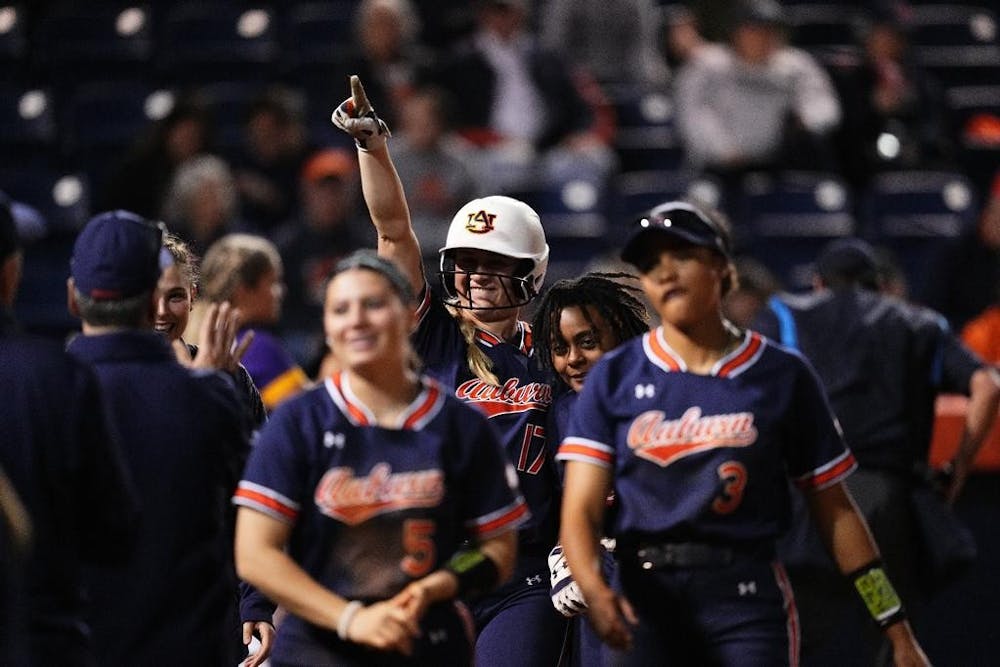 <p>Maia Engelkes (17) celebrates her first home run of the season against Tennessee Tech.</p>