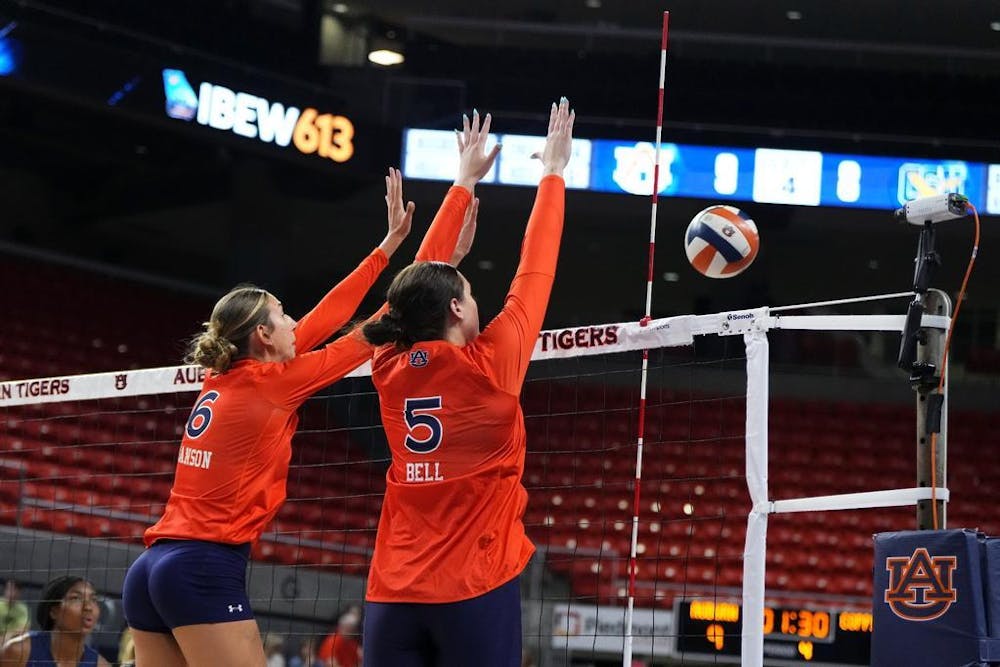AUBURN, AL - AUGUST 25 - Auburn Middle Blocker Kyla Swanson (6) and Auburn Middle Blocker Bella Bell (5) during the game between the Auburn Tigers and the Coppin State Eagles at Neville Arena in Auburn, AL on Friday, Aug. 25, 2023. Photo by Jamie Holt/Auburn Tigers