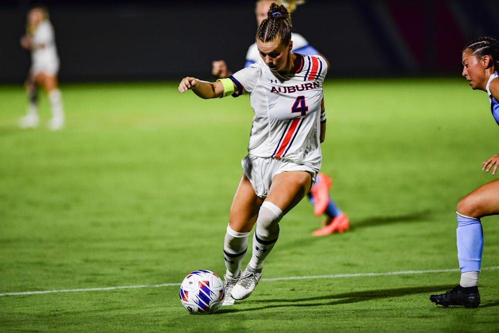 August 16, 2022; Auburn, AL, USA; Anna Haddock (4) drives the ball downfield during the match against Old Dominion at the Auburn Soccer Complex. Mandatory Credit: Jacob Taylor/AU Athletics