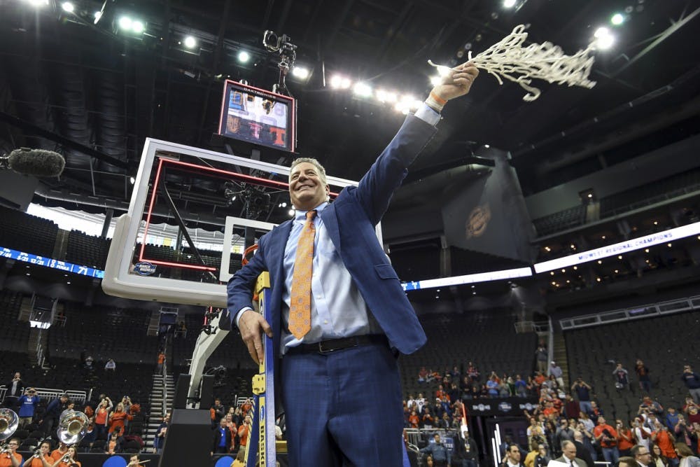 Bruce Pearl cuts down nets.JPG