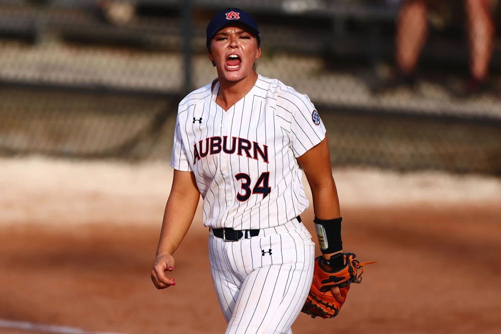 Amelia Lech celebrates a play in the field in the Tigers' victory in Clearwater, Fla.