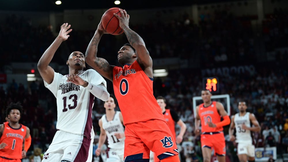 <p>K.D. Johnson (0) goes up for a contested layup against Mississippi State on March 3.&nbsp;Credit: AU Athletics&nbsp;</p>