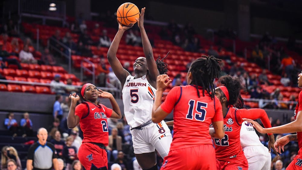 <p>Aicha Coulibaly goes for a layup against Ole Miss. Credit: Grayson Belanger/Auburn Athletics</p>