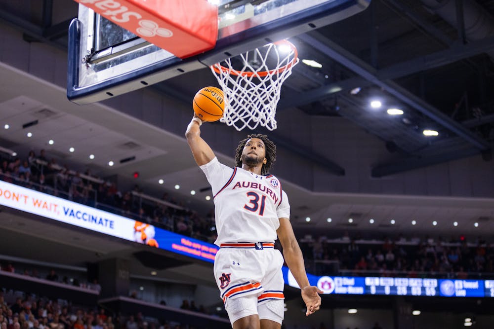 Chaney Johnson throws one down during Auburn vs Georgia State on Dec. 17, 2024. Photo by Luca Flores | The Auburn Plainsman