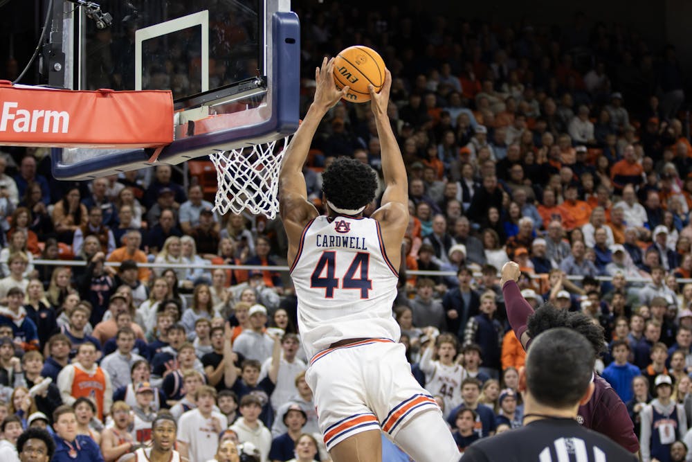 Dylan Cardwell (#44) slams down a dunk versus Mississippi State in Neville Arena on January 14th, 2024. Phot by Maggie Bowman | The Auburn Plainsman