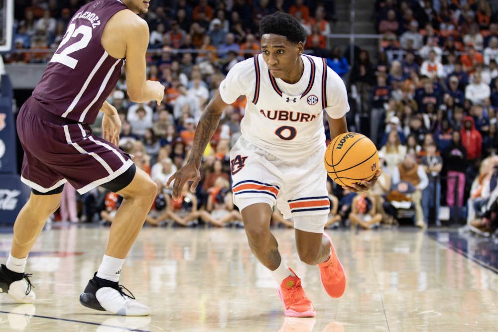 Tahaad Pettiford (#0) attacks a Mississippi State defender in Neville Arena on January 14th, 2024. Photo by Maggie Bowman | The Auburn Plainsman