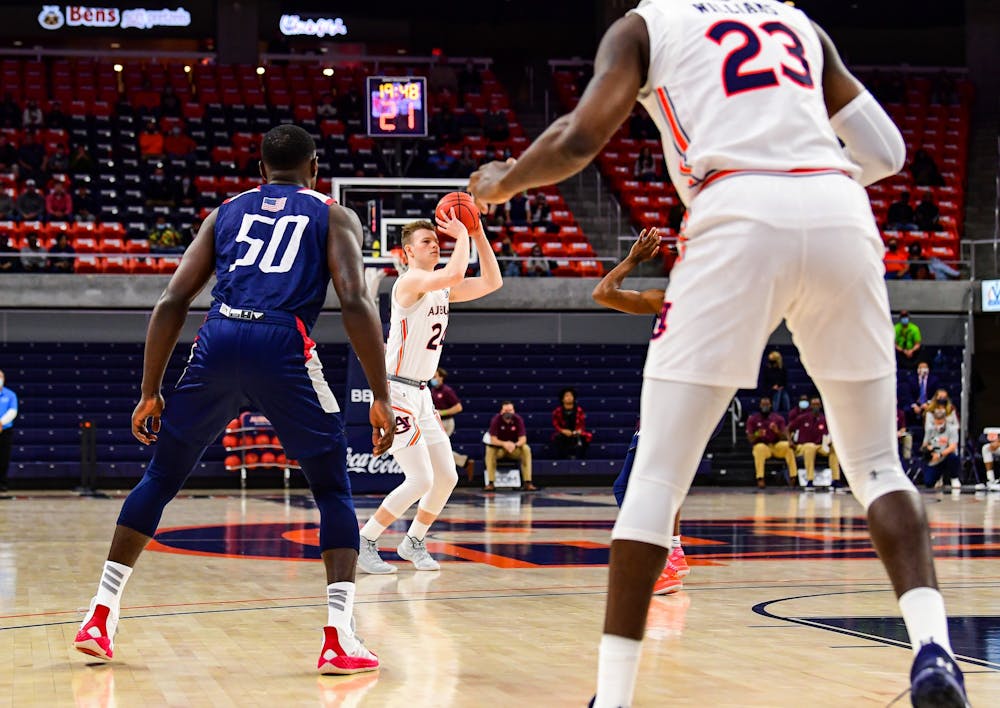 Dec 4, 2020; Auburn, AL, USA; Justin Powell (24) goes for a three during during the game between Auburn and South Alabama at Auburn Arena. Mandatory Credit: Shanna Lockwood/AU Athletics
