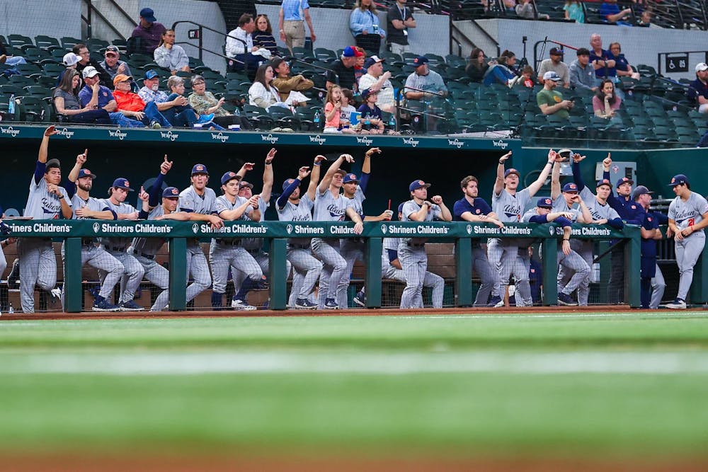 The Auburn Tigers dugout celebrates a hit at the Amegy Bank College Baseball Series in Arlington, Tex.