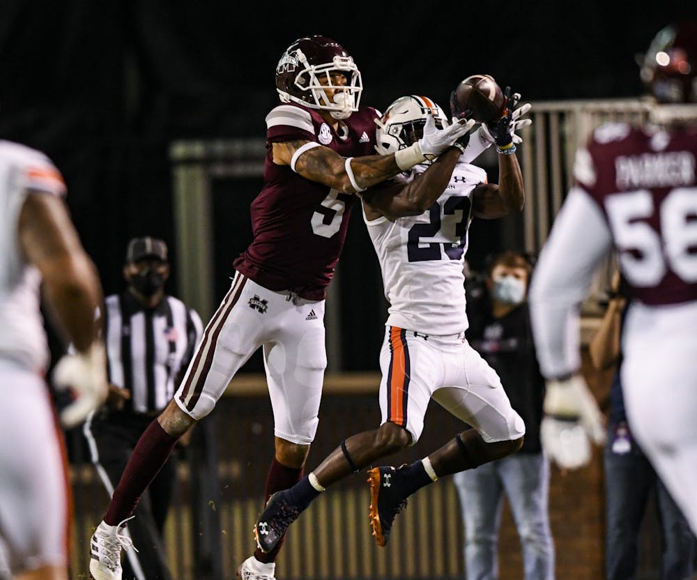 Oct 3, 2020; Starkville, Mississippi, USA; Roger McCreary (23) gets an interception during the game between Auburn and Mississippi State at Davis Wade Stadium. Mandatory Credit: Todd Van Emst/AU Athletics