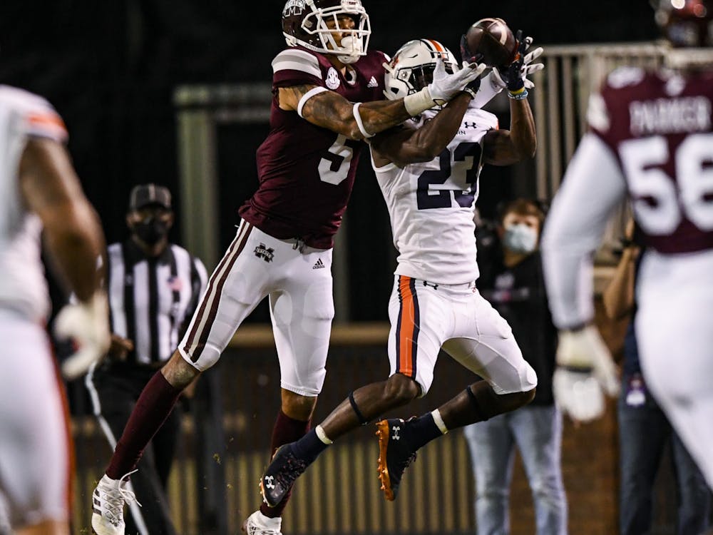 Oct 3, 2020; Starkville, Mississippi, USA; Roger McCreary (23) gets an interception during the game between Auburn and Mississippi State at Davis Wade Stadium. Mandatory Credit: Todd Van Emst/AU Athletics