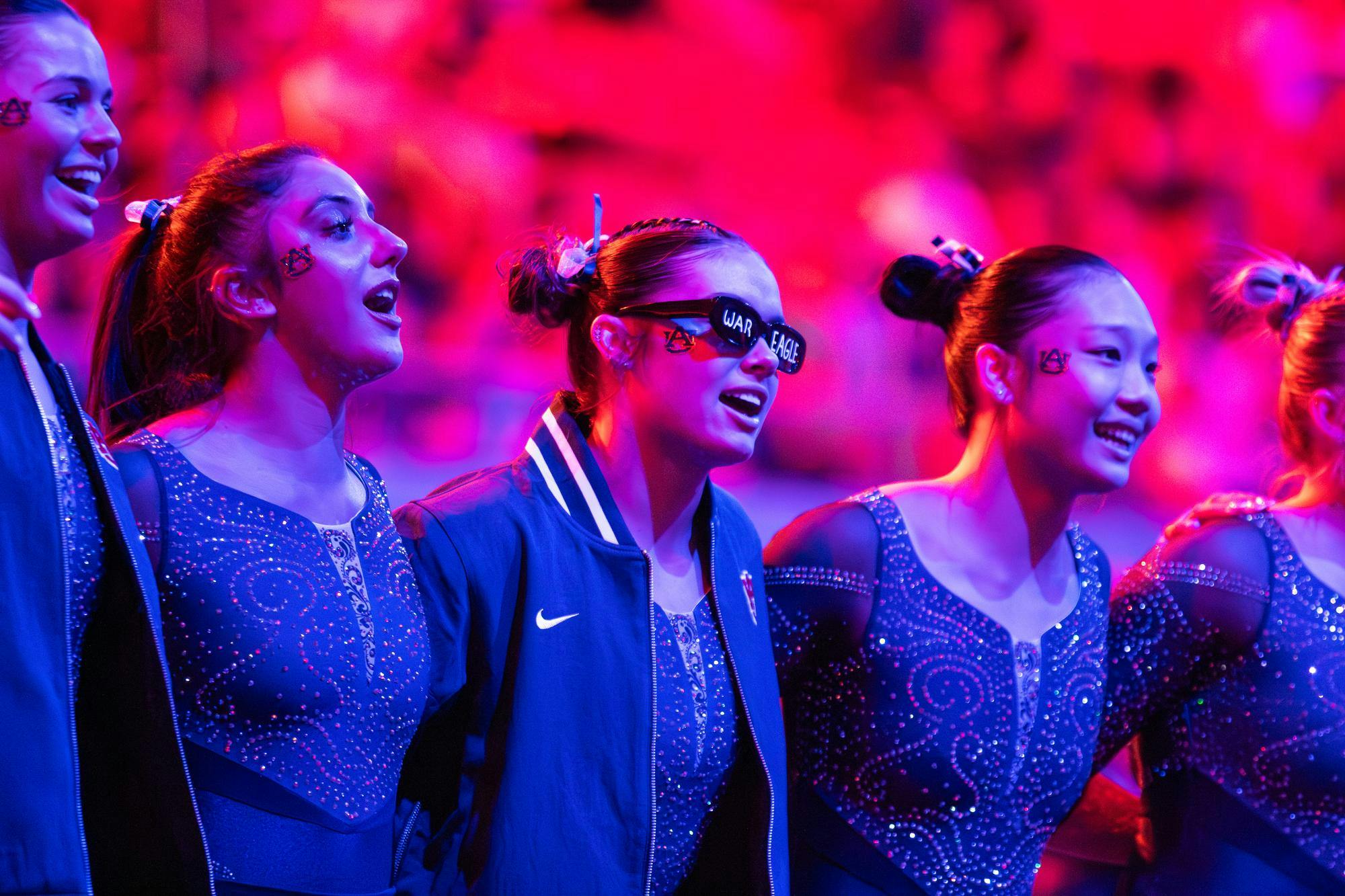 The Auburn gymnastics team performs swag surf before the final section of the meet against Florida on Jan. 23, 2026 in Neville Arena in Auburn, Ala.