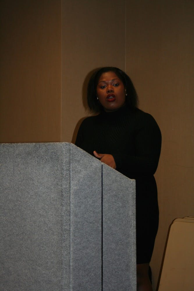 Shannon Arthur, one of the members of the group of African American leaders, speaks to the crowd at Monday's Black Student Union meeting.