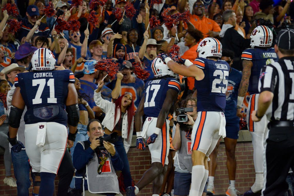 Camden Brown celebrates a touchdown with the student section in match of Auburna and LSU at Jordan-Hare Stadium on Oct.1 , 2022