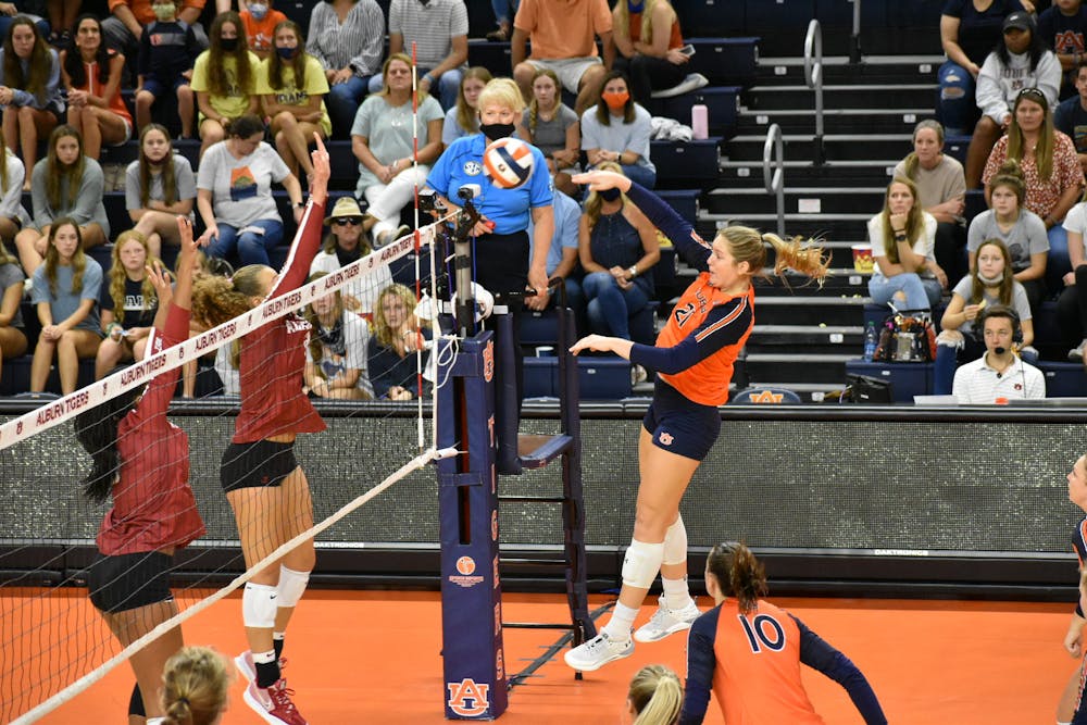 <p>Oct. 3, 2021; Auburn, AL, USA; Tatum Shipes (21) rises up and spikes the ball during a match between Auburn and Alabama in the Auburn Arena.</p>