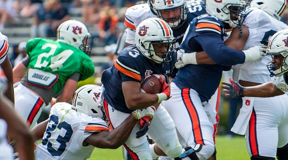 <p>D.J. Williams (3) runs with the ball during A-Day 2019, on Saturday, April 13, 2019, in Auburn, Ala.</p>