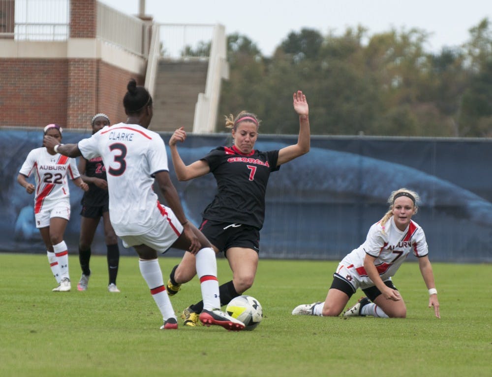 Kiana Clarke (3)&nbsp;kicks&nbsp;the ball that will strike Andie Fontanette's (7) head&nbsp;during Auburn's match against Georgia at the Auburn Soccer Complex on Sunday, Oct. 25.