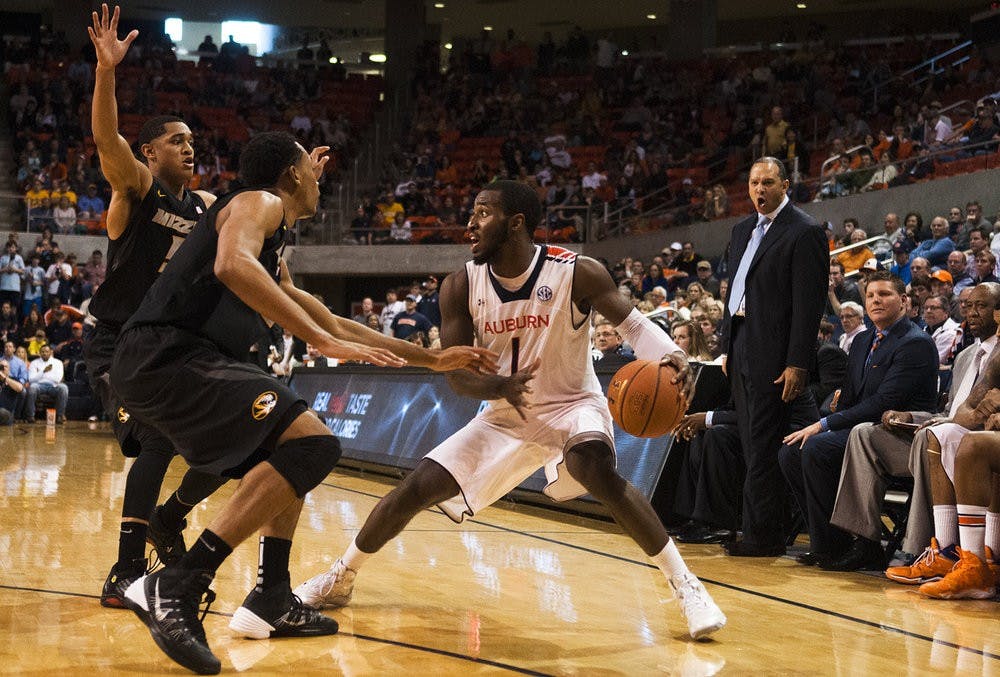 Auburn Head Coach Tony Barbee yells from the bench as Auburn guard KT Harrell (1) attempts to dribble past two Missouri defenders, Jan. 11, 2014. (Zach Bland / Assistant Photo Editor)