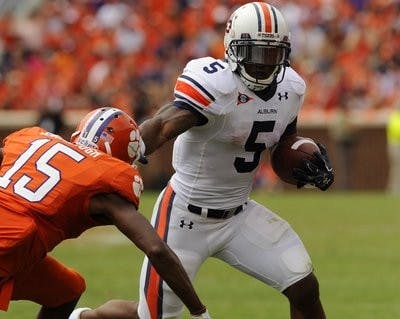 Running back Michael Dyer sprints from an opposing Tiger at Saturday's game. (Todd Van Emst / AUBURN MEDIA RELATIONS)
