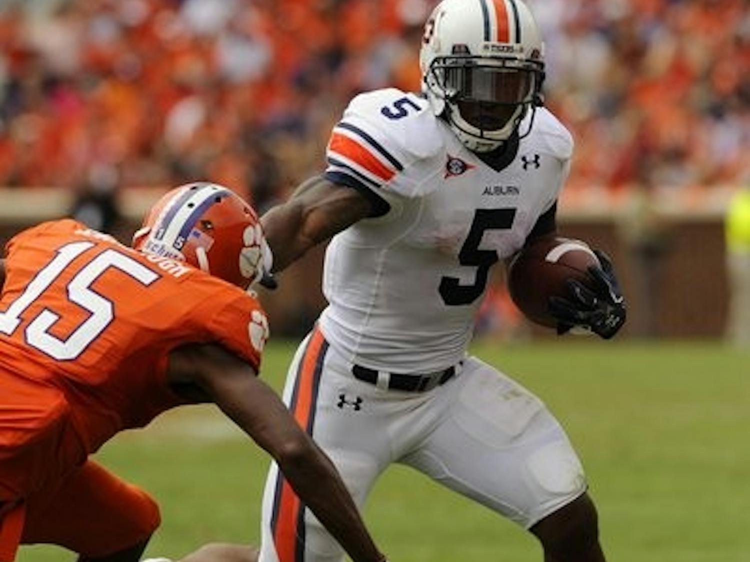 Running back Michael Dyer sprints from an opposing Tiger at Saturday's game. (Todd Van Emst / AUBURN MEDIA RELATIONS)