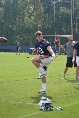 Philip Lutzenkirchen does the Heisman during last week's practices. (Danielle Lowe / ASSISTANT PHOTO EDITOR)
