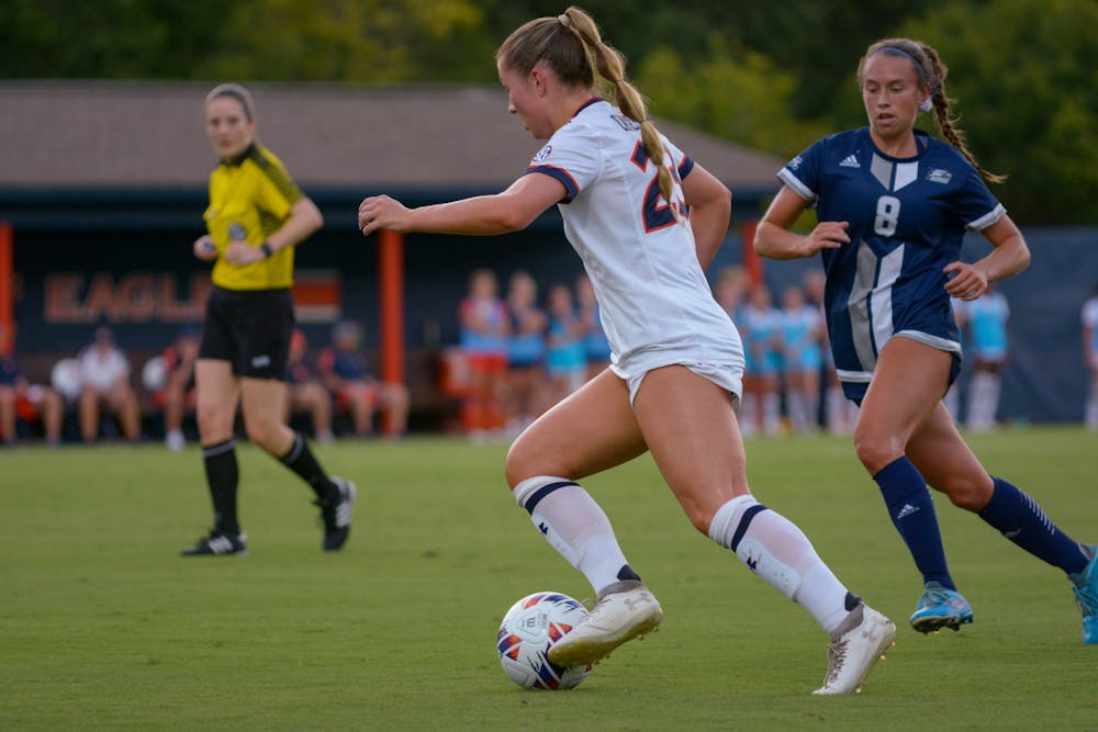 Olivia Candelino brings the ball up the field past GSU defenders 8/8/22