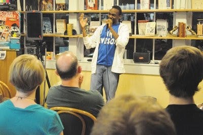 Comedian Martin Morrow cracks a joke for a laughing crowd at The Gnu's Room Friday night. (Christen Harned / ASSISTANT PHOTO EDITOR)