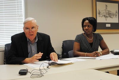 Jim Byram and Sharon Tolbert discuss the $3.95 million grant for the new housing development plans on Martin Luther King Drive, Tuesday. (Maria Iampietro / ASSOCIATE PHOTO EDITOR)