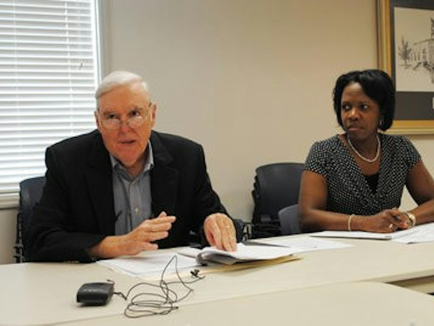 Jim Byram and Sharon Tolbert discuss the $3.95 million grant for the new housing development plans on Martin Luther King Drive, Tuesday. (Maria Iampietro / ASSOCIATE PHOTO EDITOR)