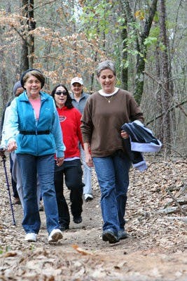 From left: Auburn Stride Walkers Melissa Weldon, Dee Watson, Debbie Flick et al walk a trail behind Ogletree Elementary School. (Rebecca Croomes / PHOTO EDITOR)