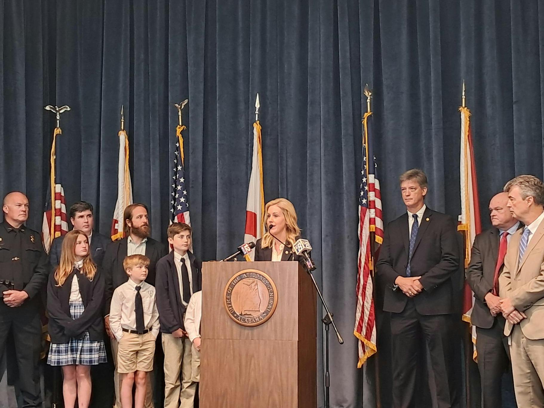 Chief Counsel Katherine Robertson stands at a podium and speaks about the Roblox settlement at a press conference on April 21.