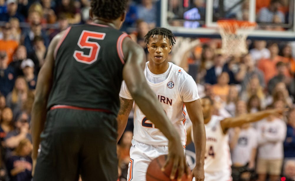 <p>Allen Flanigan (22) watches as Anthony Edwards (5) dribbles the ball during Auburn Men's Basketball vs. Georgia, on Saturday, Jan. 11, 2019, in Auburn, Ala.</p>