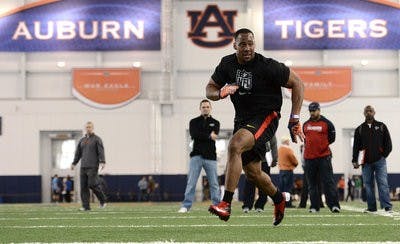 Former Auburn defender Corey Lemonier runs linebacker drills for scouts Tuesday. (COURTESY OF TODD VAN EMST)