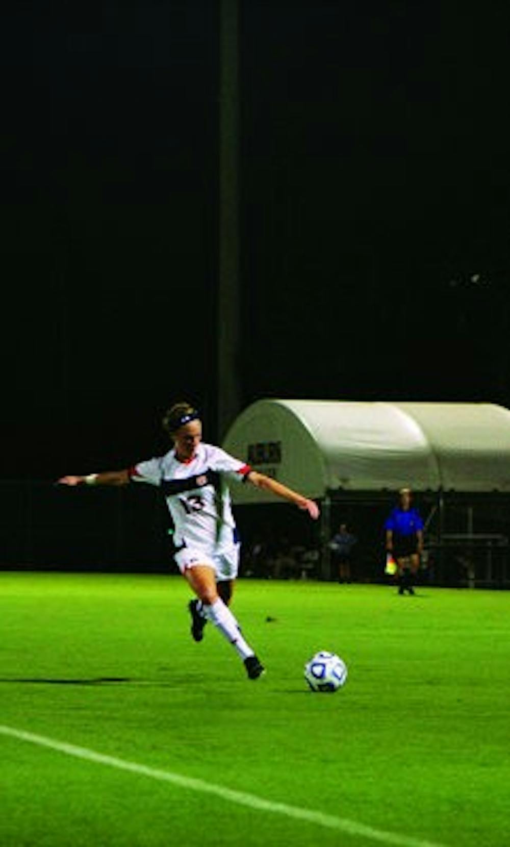 Junior forward Mary Coffed makes a pass against Kennesaw State last season. (Rebecca Croomes / ASSISTANT PHOTO EDITOR)