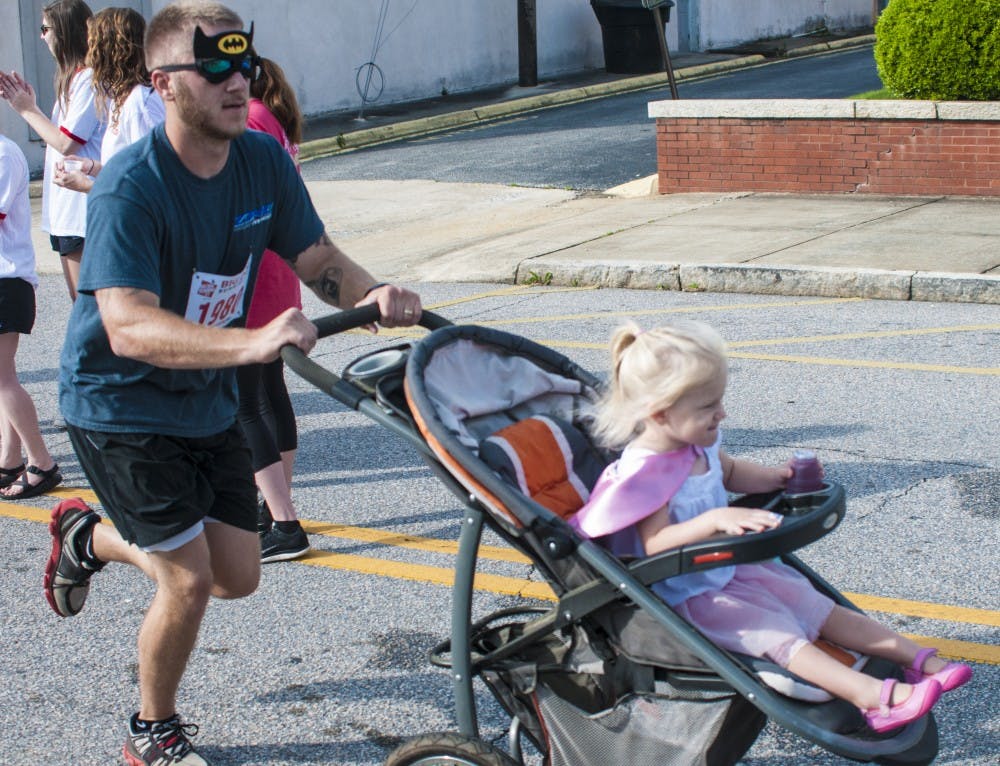 Cameron and Paisley Kirt&nbsp;runs the&nbsp;5k at the 2016 Superhero Opelika 5k on Saturday, Apr., 30 in Opelika Ala.&nbsp;