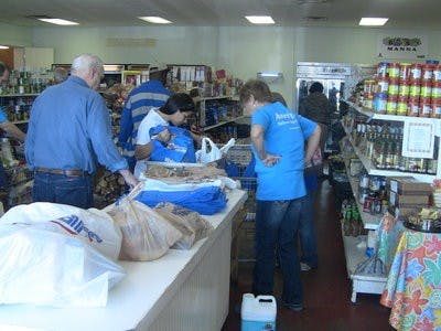 At the Community Market, shoppers have the ability to select what food they would like up to 75-100 pounds depending on family size. (Laura Hobbs / WRITER)