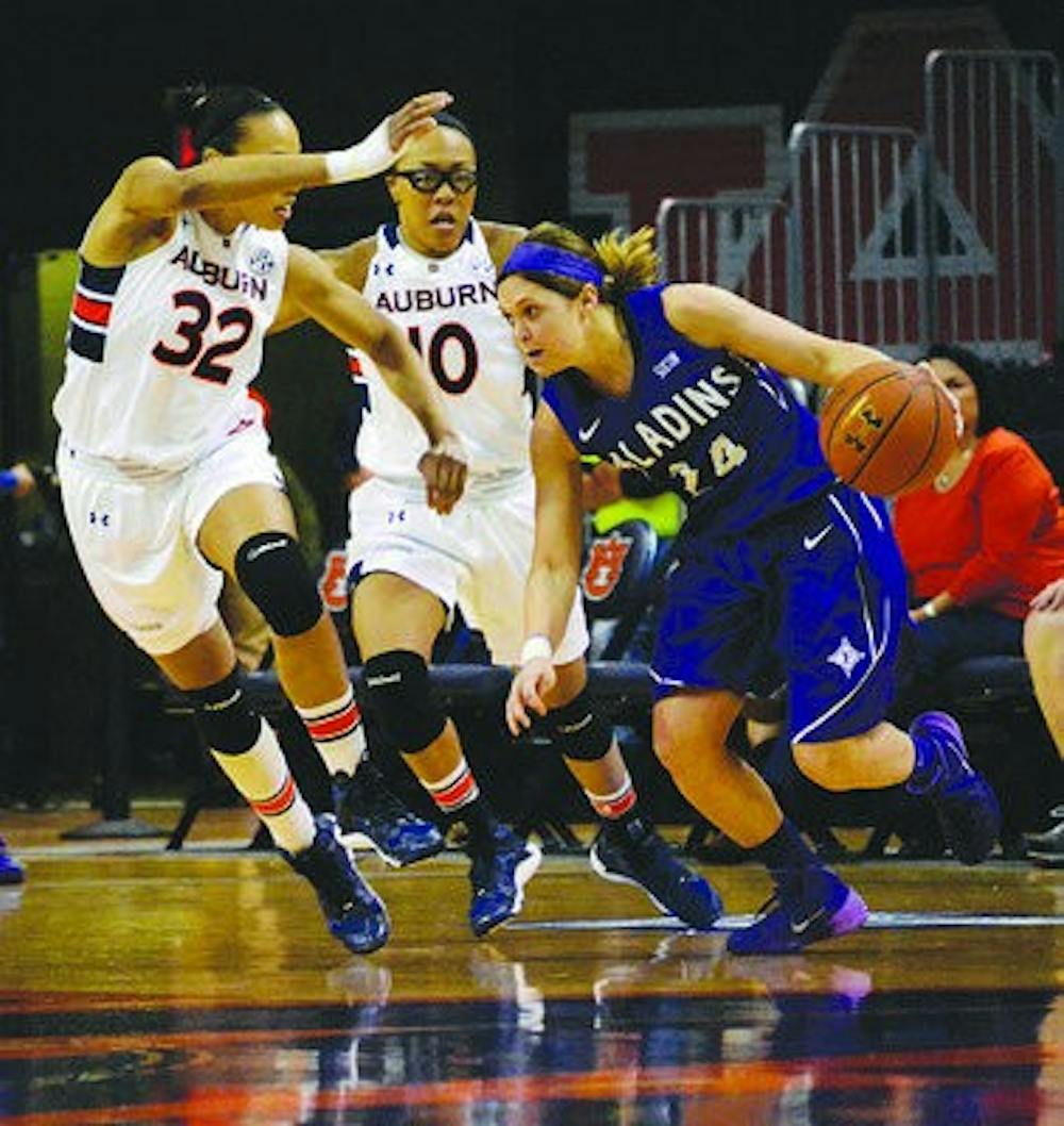 Tyrese Tanner and Brandi Montgomery closes out on Furman's Brigid Morrissey. (Sarah May / Photo Editor)