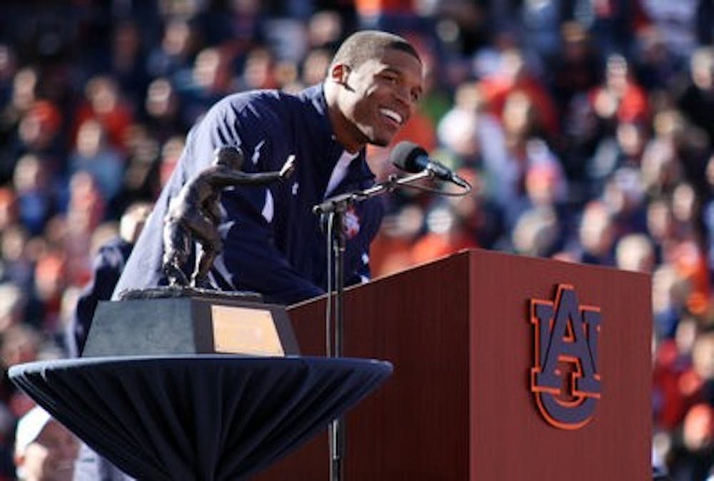 Cam Newton speaks after being presented the Heisman Trophy at the celebration. (Emily Adams/PHOTO EDITOR)