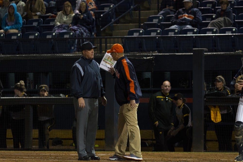 Auburn softball head coach Mickey Dean disputes a call with an umpire&nbsp;vs. Kennesaw State University on April 4, 2018, in Auburn, Ala.