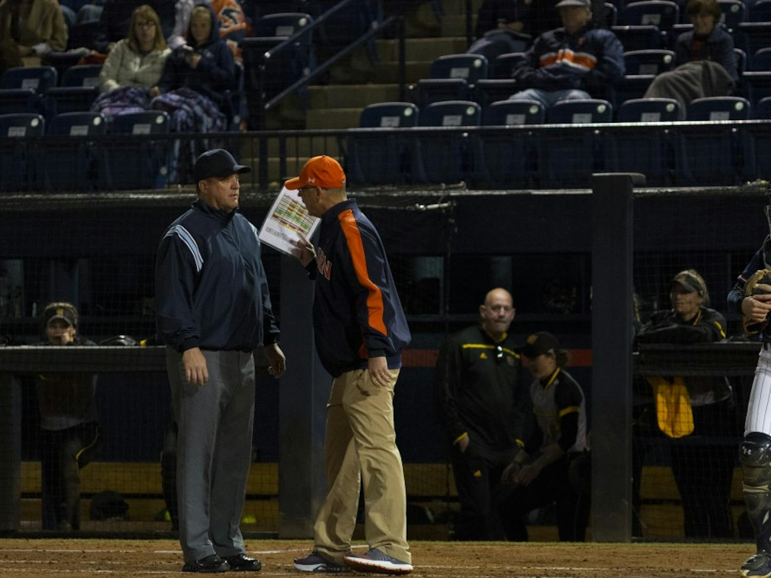 Auburn softball head coach Mickey Dean disputes a call with an umpire&nbsp;vs. Kennesaw State University on April 4, 2018, in Auburn, Ala.