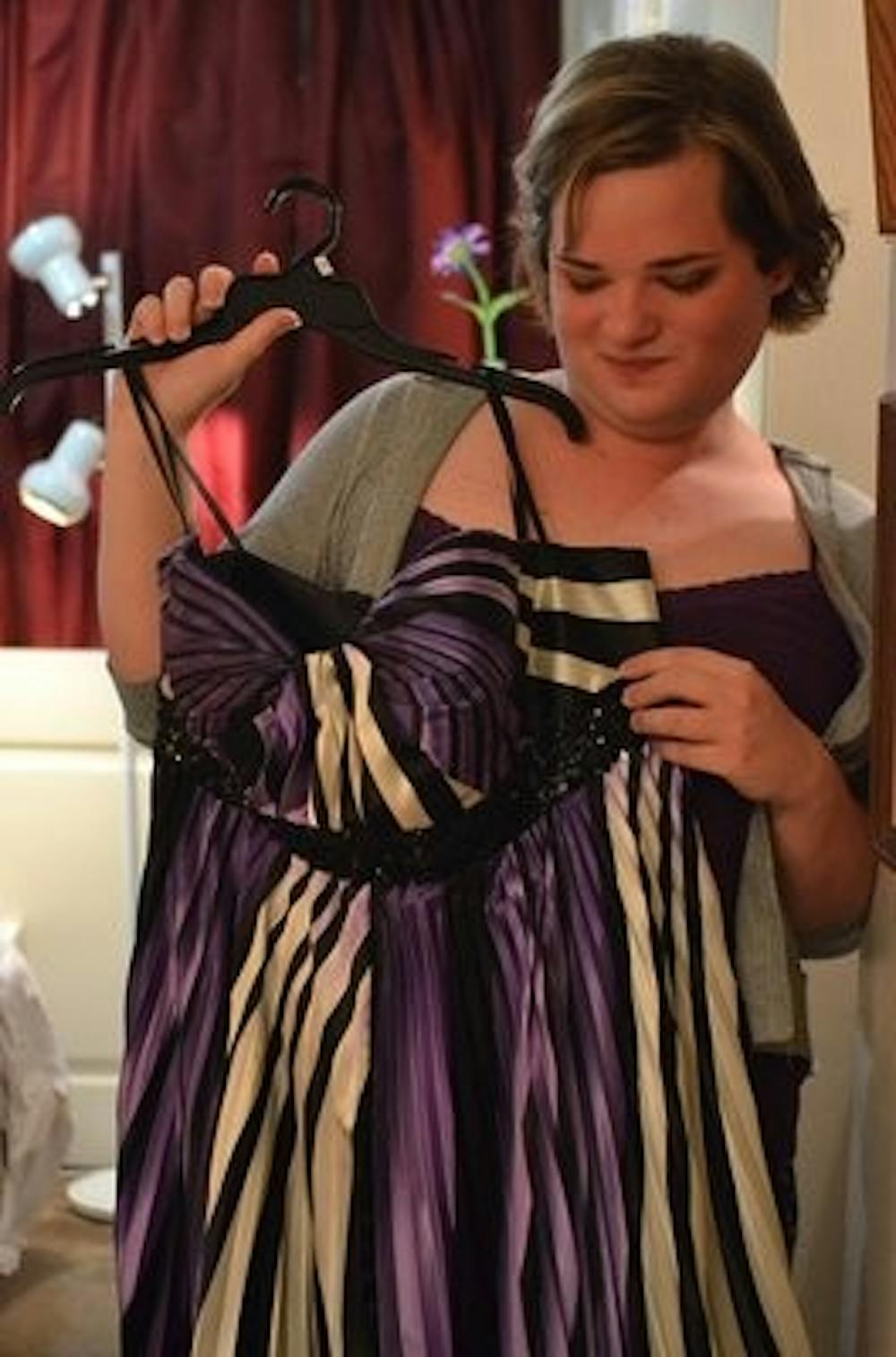Corbitt shows her prom dress. It had to be her favorite color, purple.