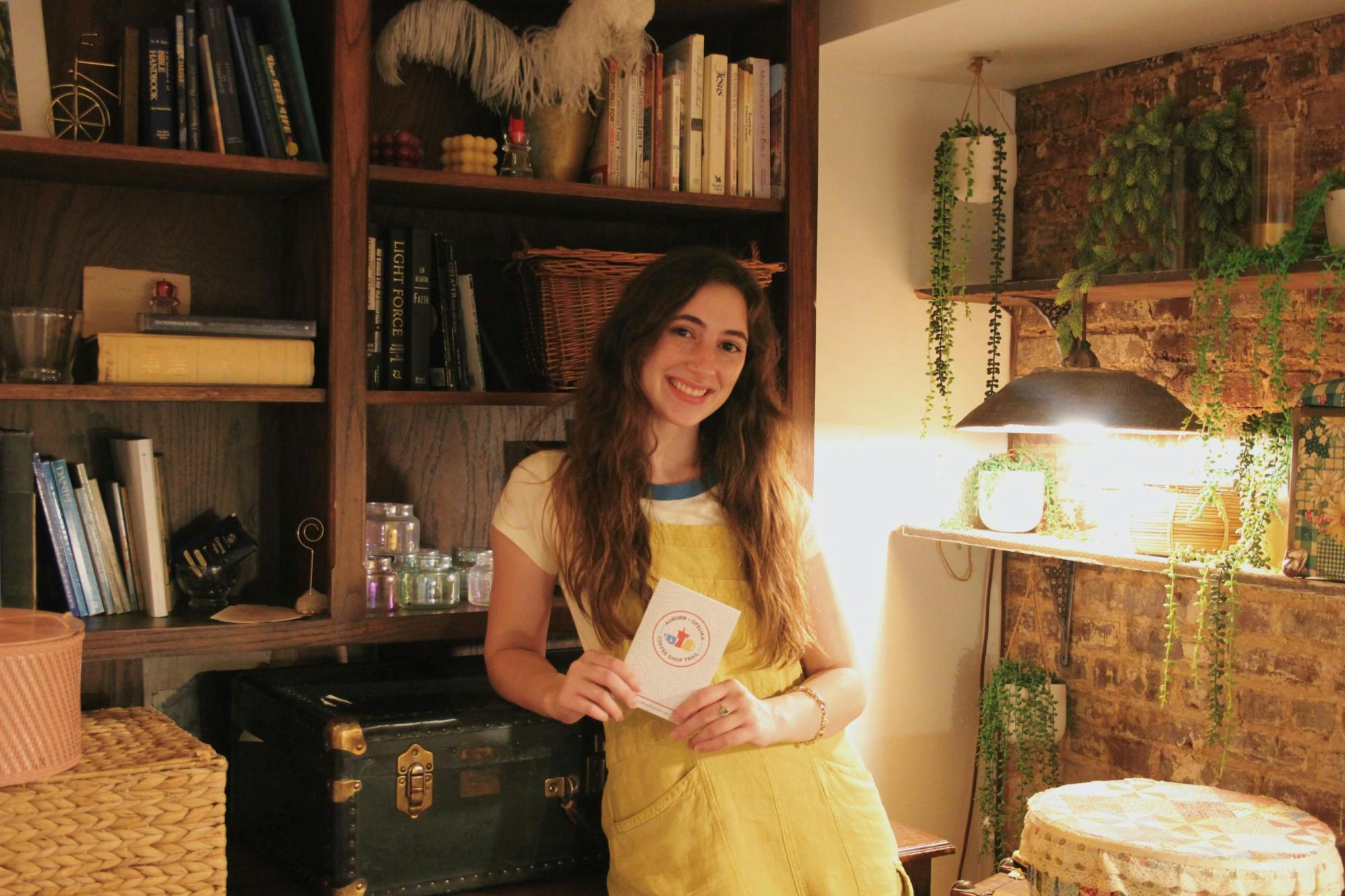 Elizabeth Hobbs holding coffee trail booklet