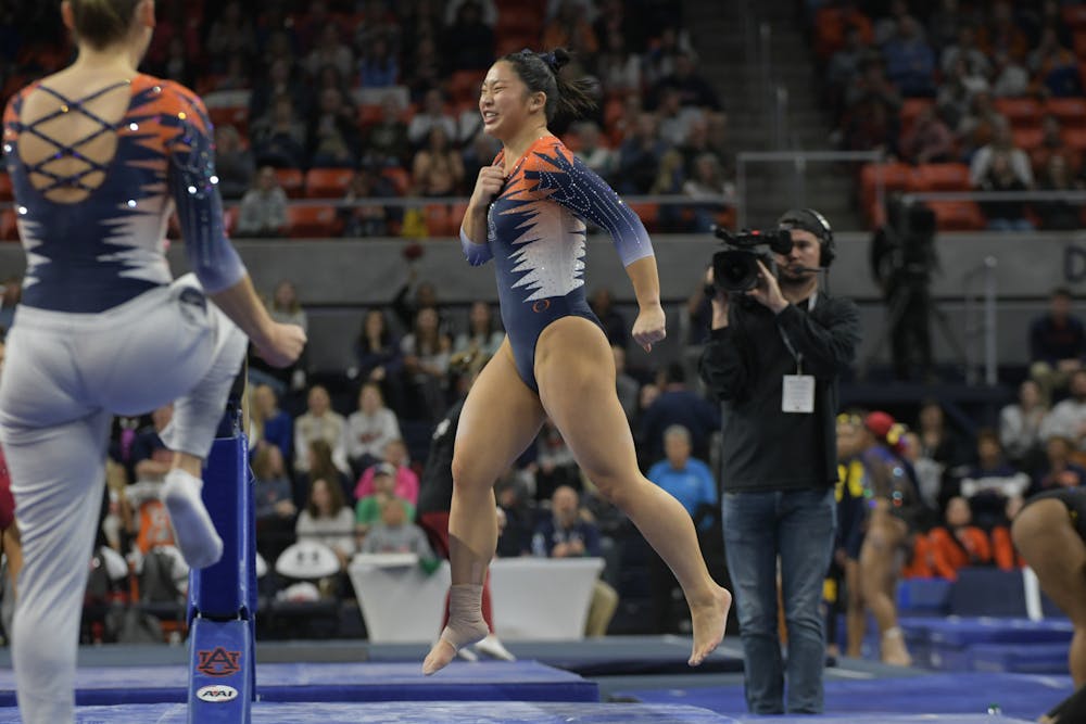 <p>Sophia Groth celebrating her beam routine at Quad Meet in Neville Arena on February 2nd 2024</p>