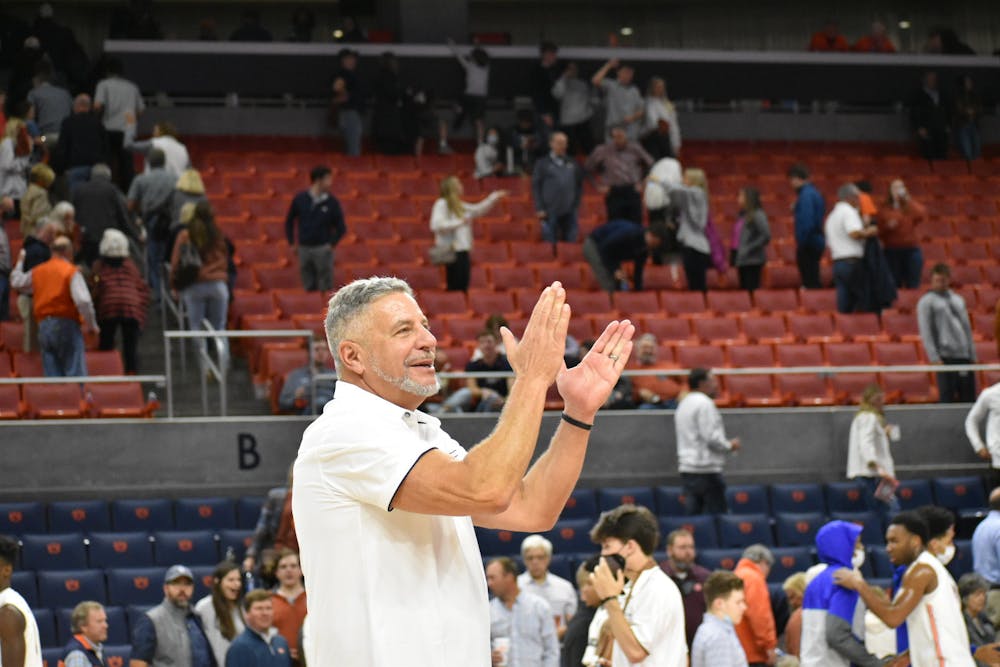 <p>Nov. 9, 2021; Auburn, Alabama; Bruce Pearl celebrates with fans after a match between Auburn and Morehead State.</p>
