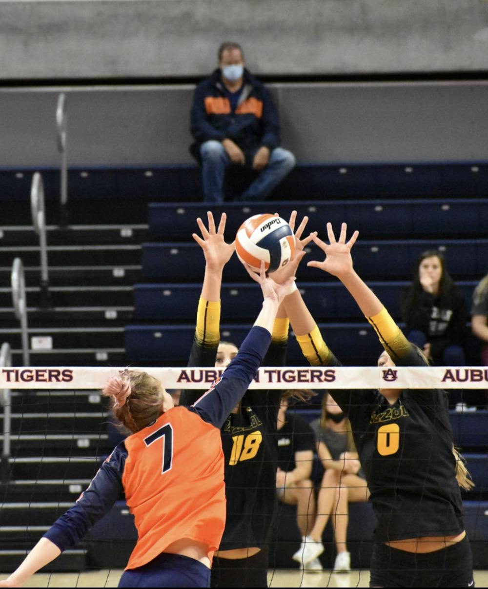 <p>Oct. 16, 2021; Auburn, AL, USA; Rebekah Rath (7) contorts the ball off of her hand in match between Auburn and Missouri in the Auburn Arena.</p>